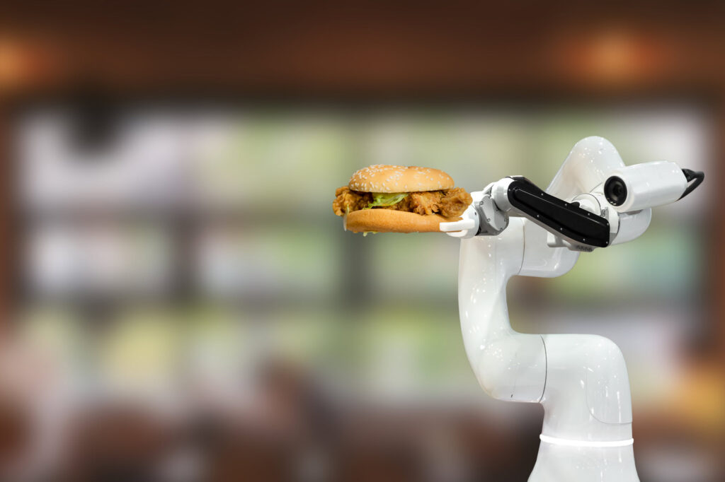 Picture of a hamburger and meat and high tech robot